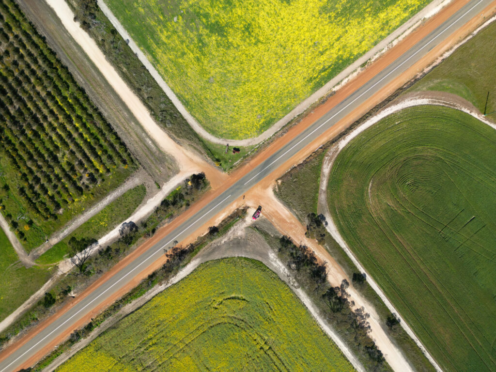 Aerial view of a rural intersection with roads and paddocks